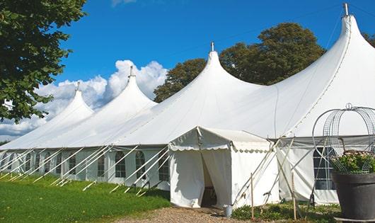 a line of portable restrooms in a shaded area, offering a comfortable experience for users in Ivins